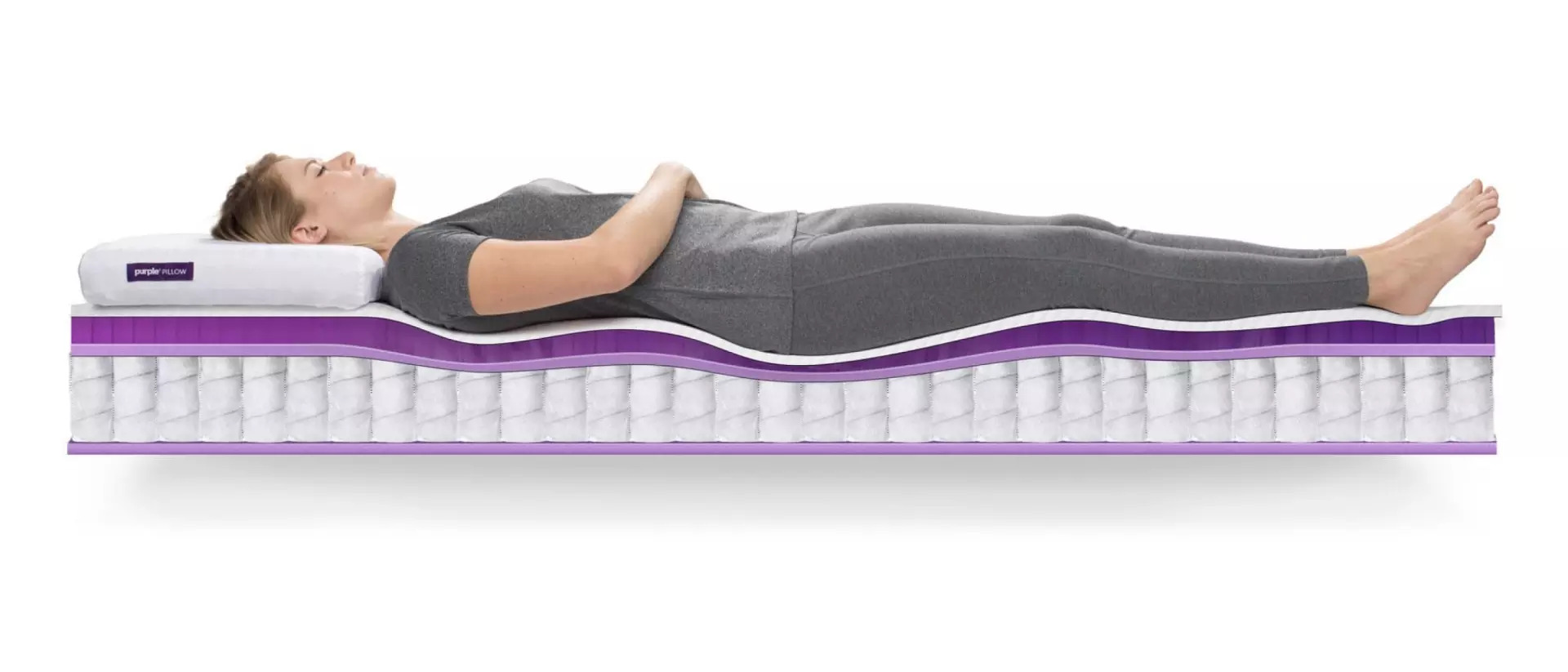 person laying on purple mattress crosssection