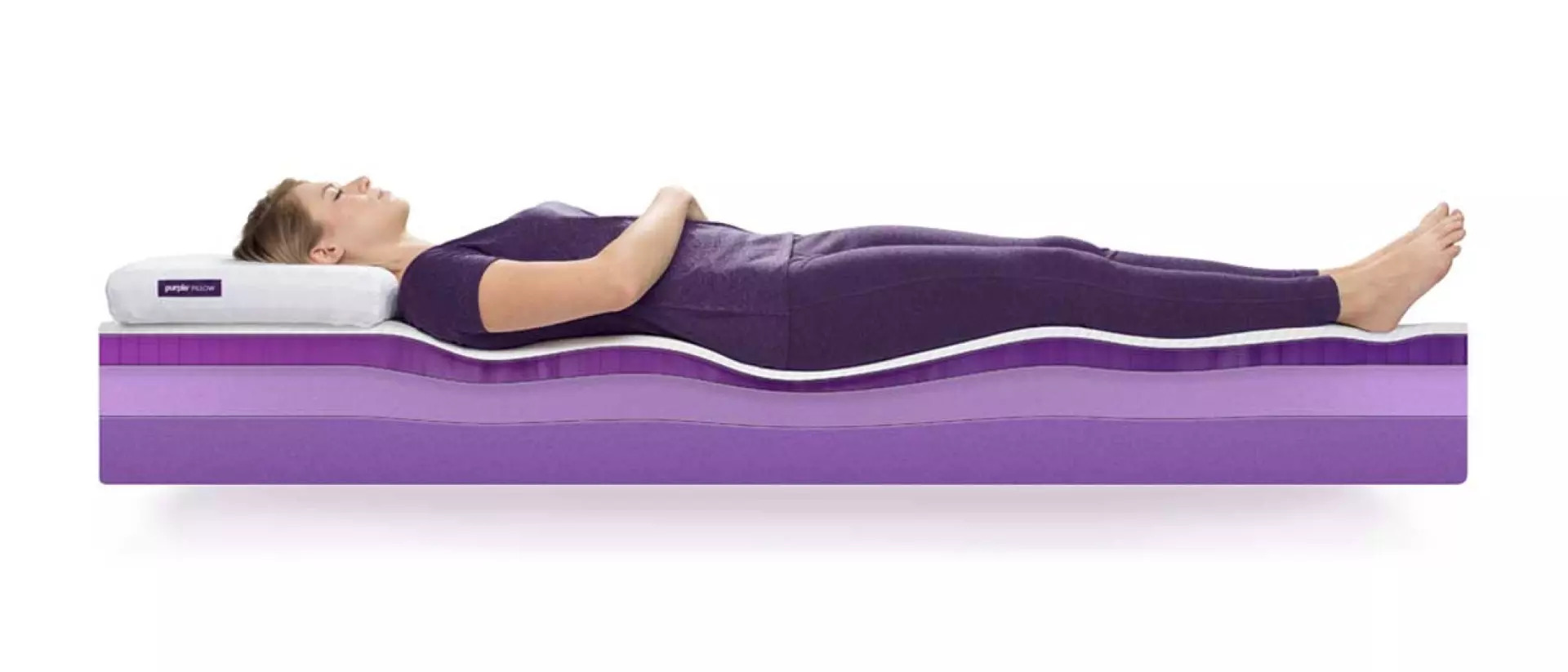 person laying on purple mattress crosssection